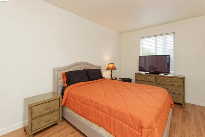 Bedroom with light wood-style floors