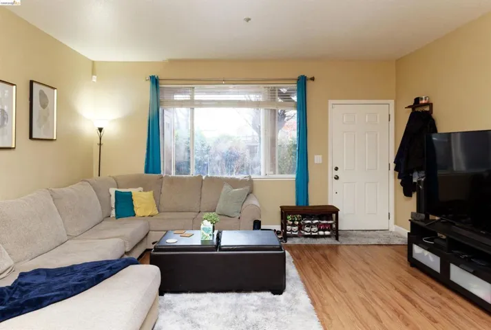 Living area featuring light wood finished floors and baseboards