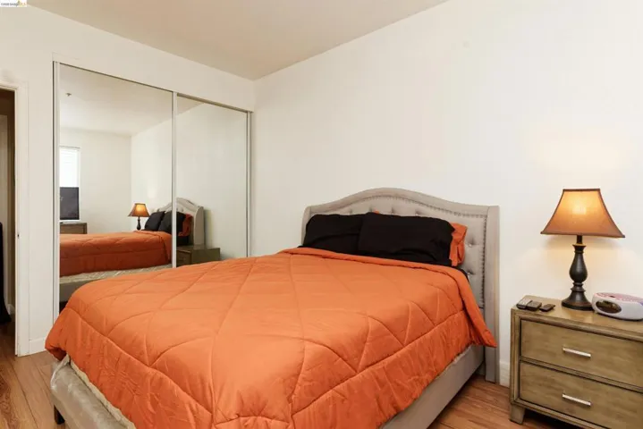 Bedroom with a closet and wood finished floors