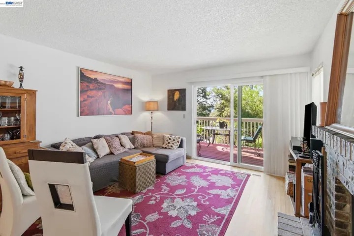 Light-filled living with a cozy fireplace—best of both.