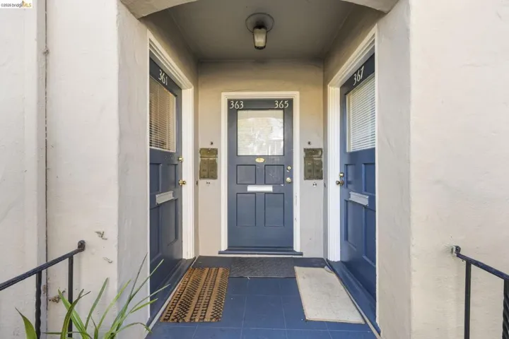 View of exterior entry with stucco siding