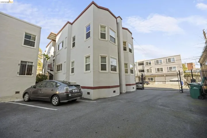 View of property with uncovered parking