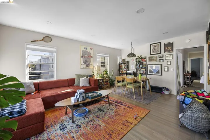 Living room with wood finished floors and plenty of natural light