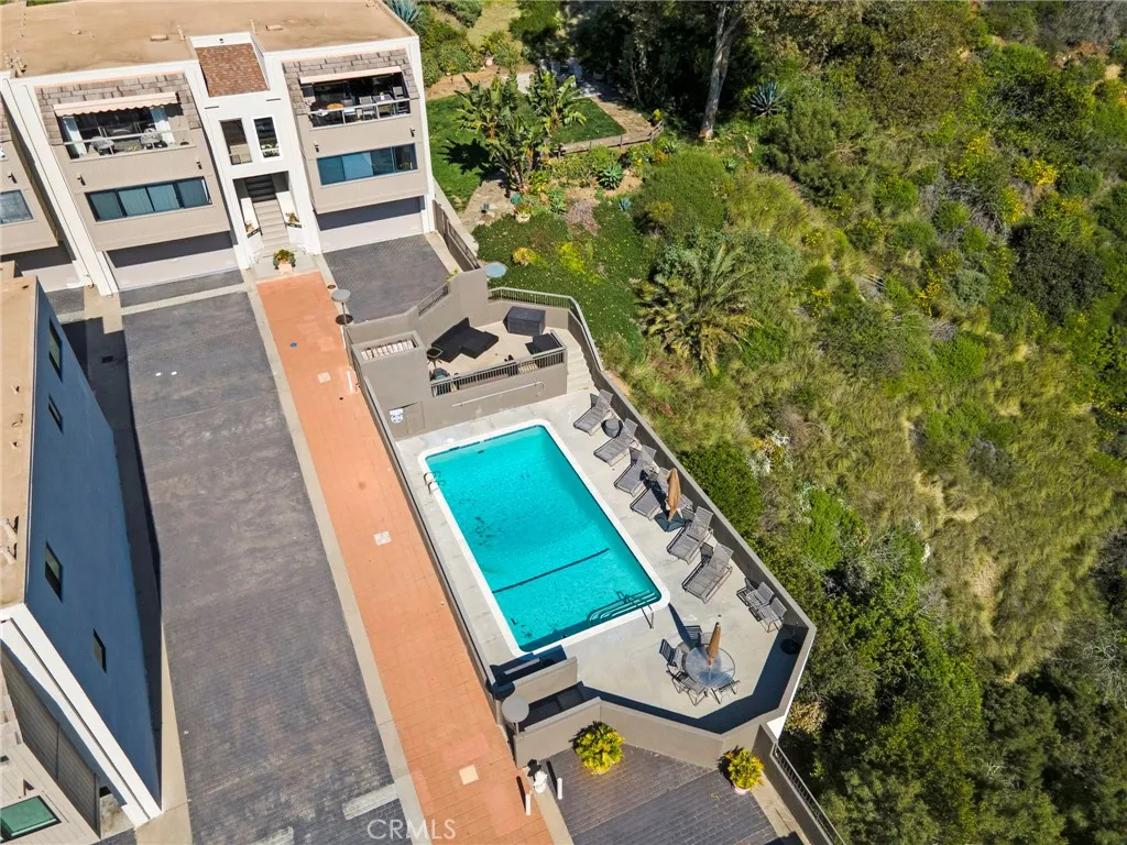 This is a drone shot of the community pool and the picnic park area just beyond.