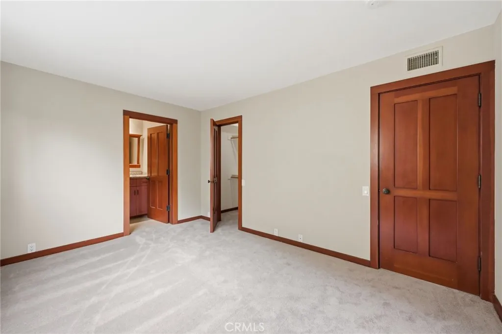 2nd bedroom with attached bath, walk-in closet and new carpeting.