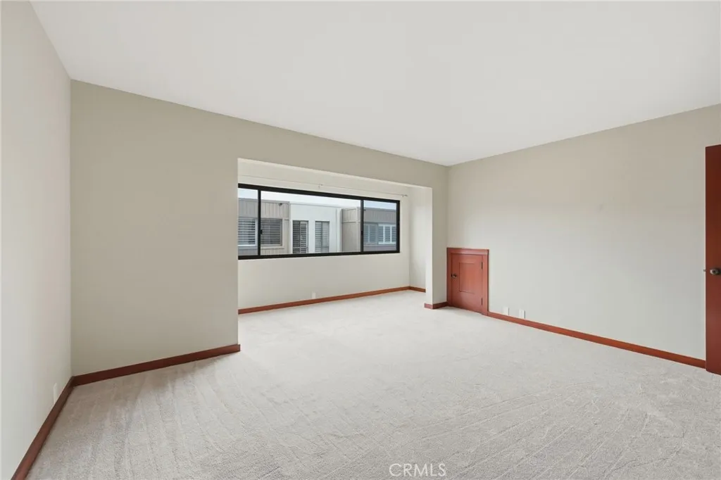 The current picture of the primary suite with  new carpeting.