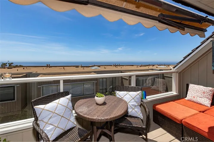 A view of the deck off the living room, with an expandable awning.