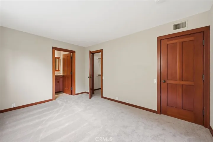 2nd bedroom with attached bath, walk-in closet and new carpeting.