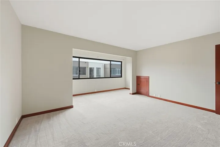 The current picture of the primary suite with  new carpeting.