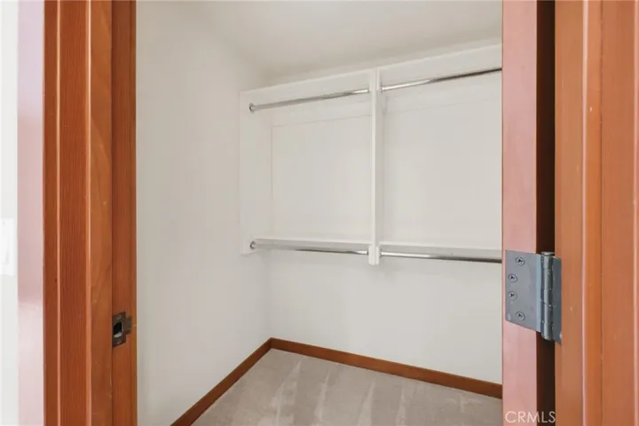 The walk-in closet in the primary suite.