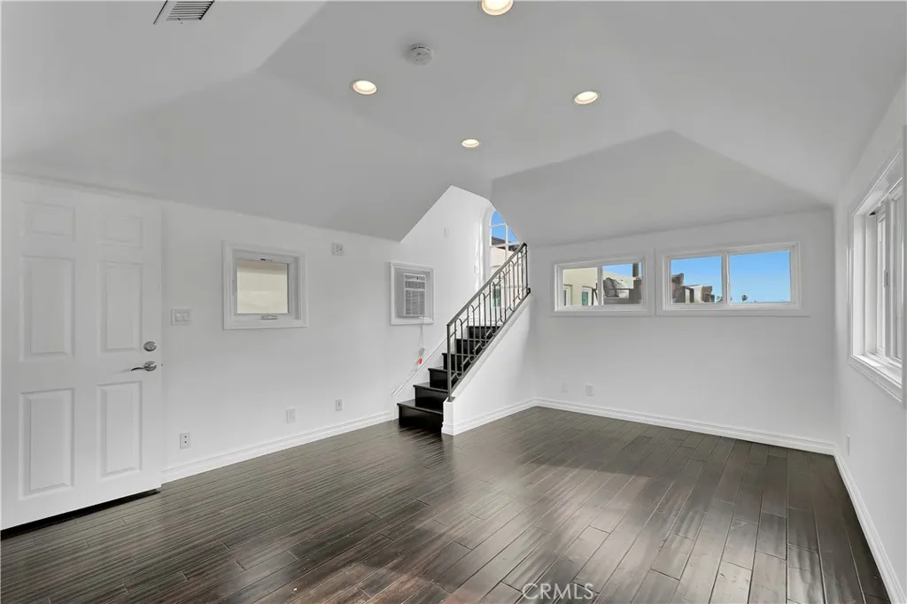 Top Floor extra bedroom or fitness room with ensuite bathroom and steps up to lounge deck w vista views of mountains ocean bay etc