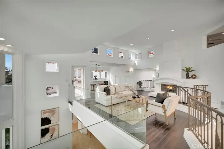 Family Room loft awaits with views and catwalk capped with skylights leading to the 3 bedroom all ensuite corridor