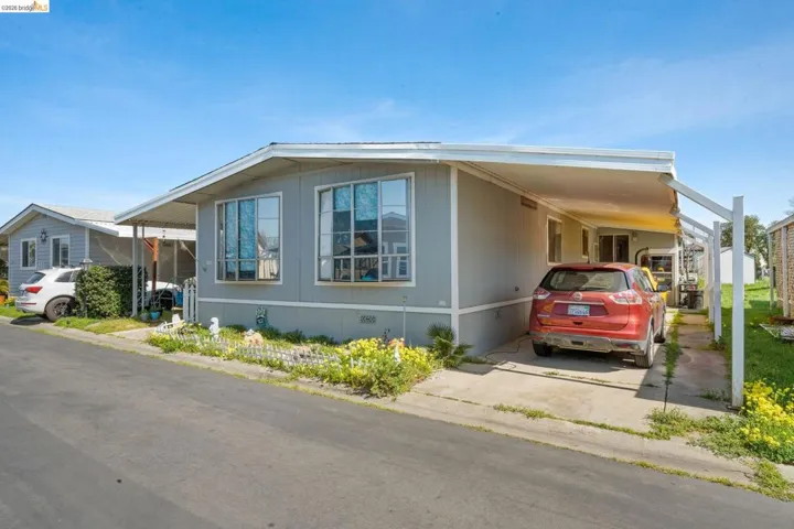 View of front of home featuring an attached carport