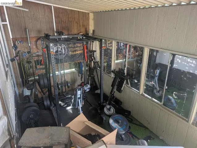 Garage featuring wooden walls