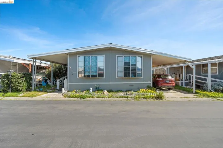 View of side of home featuring a carport