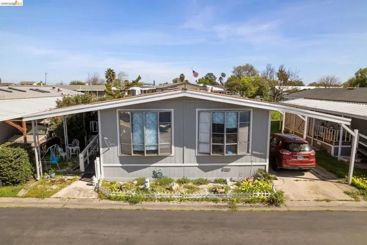View of front of property featuring a carport