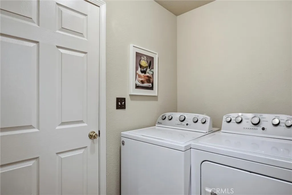 Laundry room conveniently located between dining area and garage.