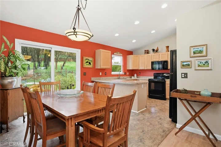 Dining area looking over breakfast bar to kitchen.