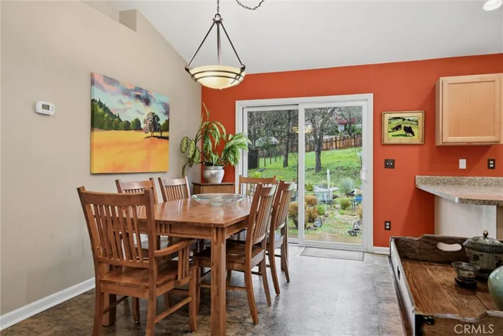 Dining area has slider to backyard.