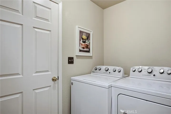 Laundry room conveniently located between dining area and garage.