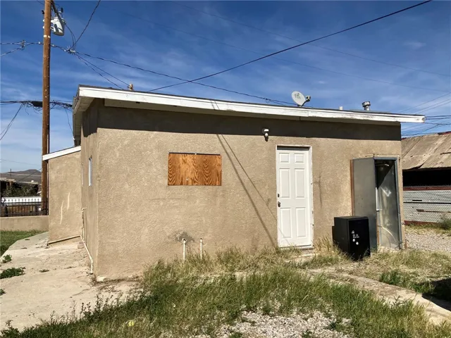 Unit 2, (front unit) -  Back and west side.  Water heater missing on this one.