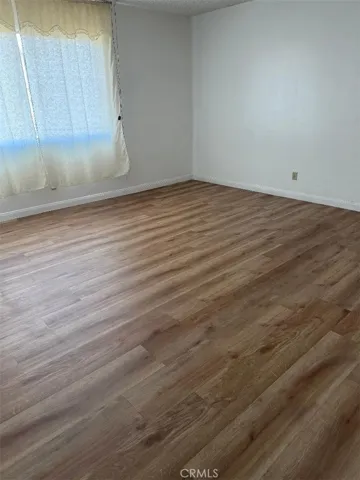 Master bedroom with newer laminate flooring