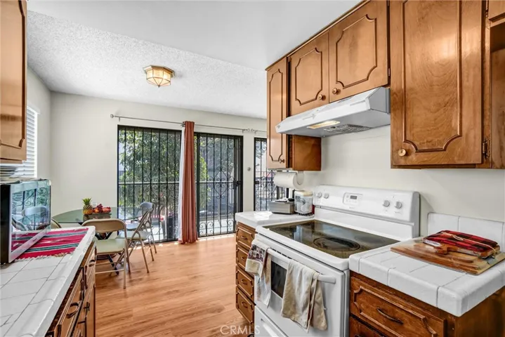 Kitchen south view toward dining area and balcony