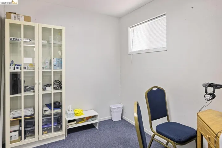 Office area with carpet flooring and baseboards