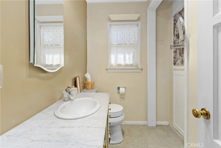 Bath #1 is a 3/4 bath between the kitchen and dining rooms.