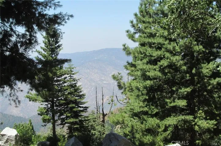 Distant view looking across Merced River canyon.