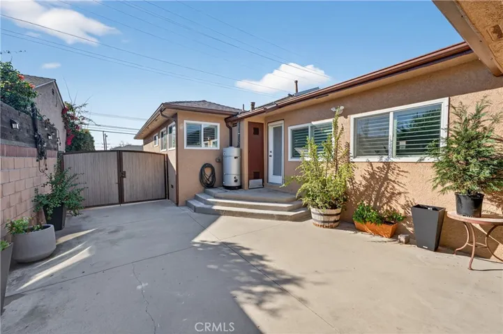 side patio between the gate and garage