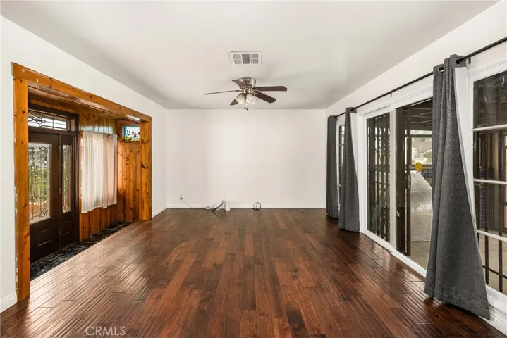 Living room with slider to sunroom