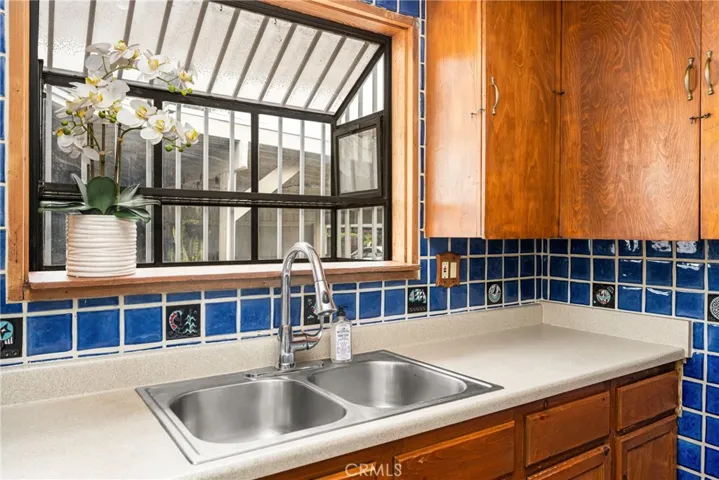 Double basin stainless steel kitchen sink and bay window