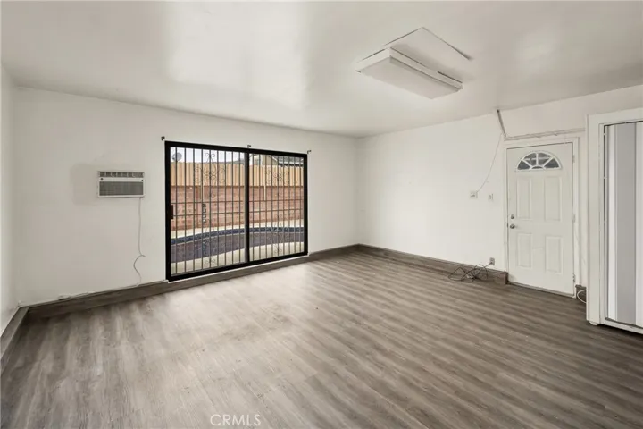 Converted garage with view, wall AC unit and slider to pool