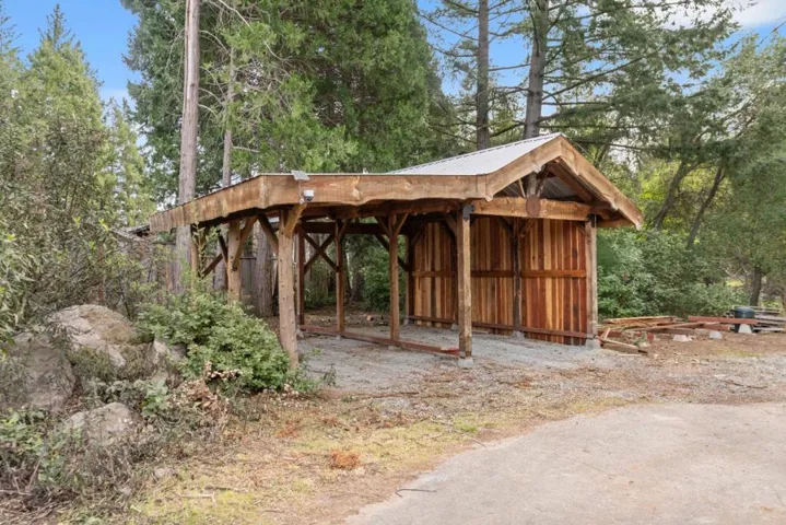 oversize carport built from wood milled onsite