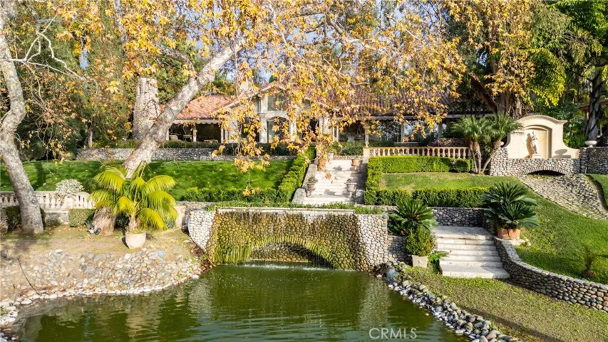Entrance pond with single family residence