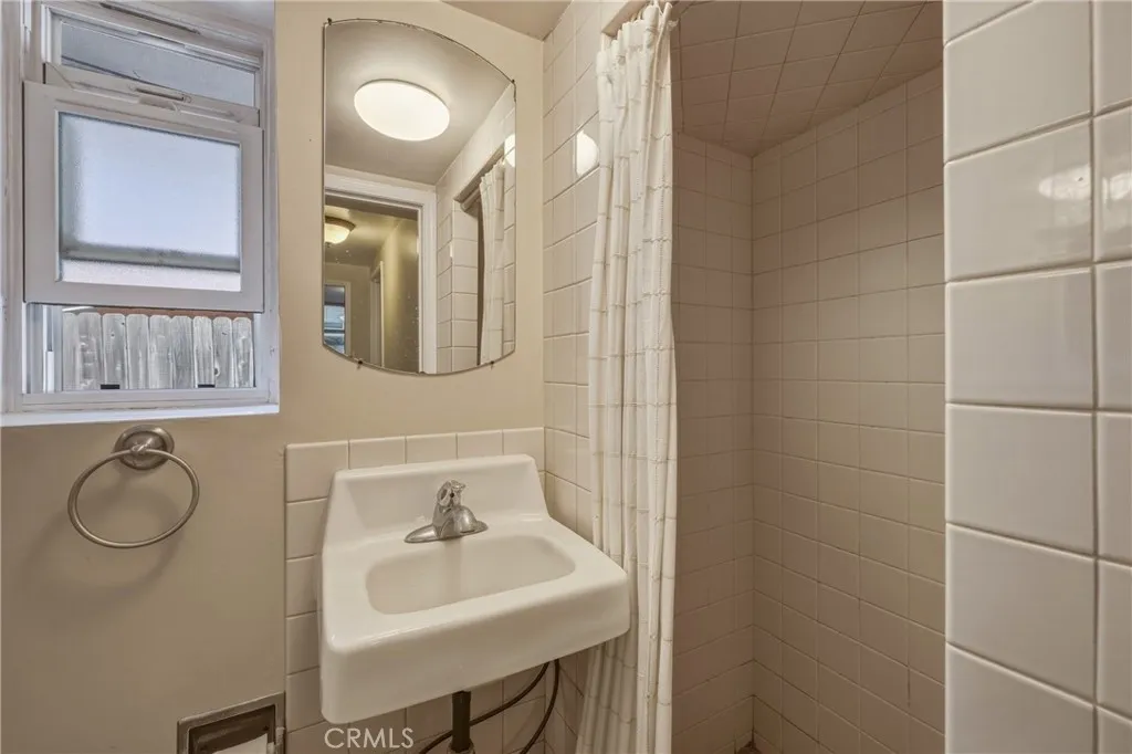Apartment downstairs bathroom with shower.