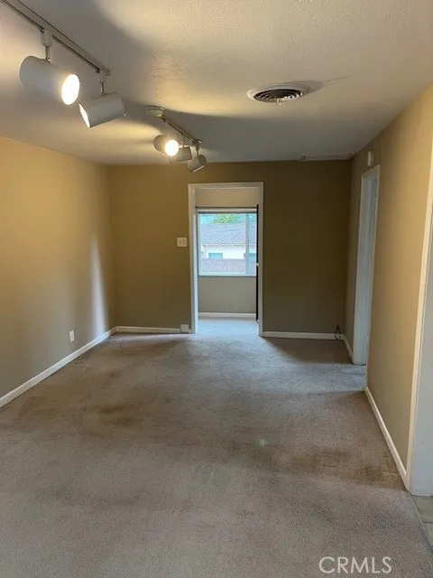 Apartment upstairs bedroom looking towards living room