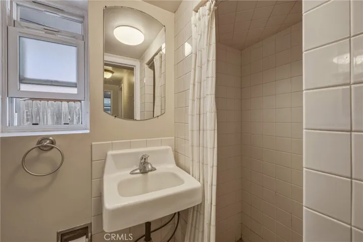 Apartment downstairs bathroom with shower.