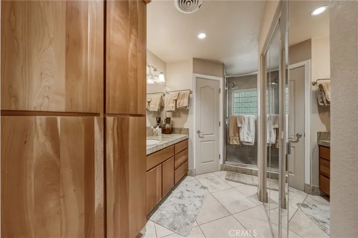 Upstairs bathroom with laundry in closet.