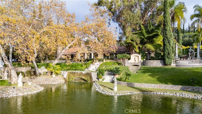 Pond and single family residence, stone bridge
