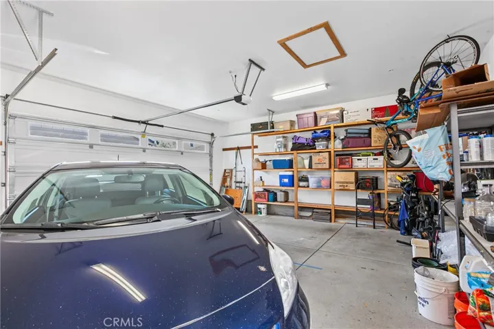 2 car garage w/ storage shelves & EV charging