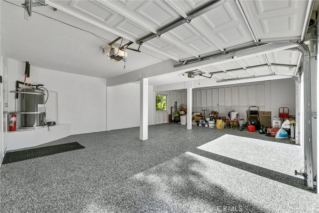 Garage with third space for car or large work bench/storage area.