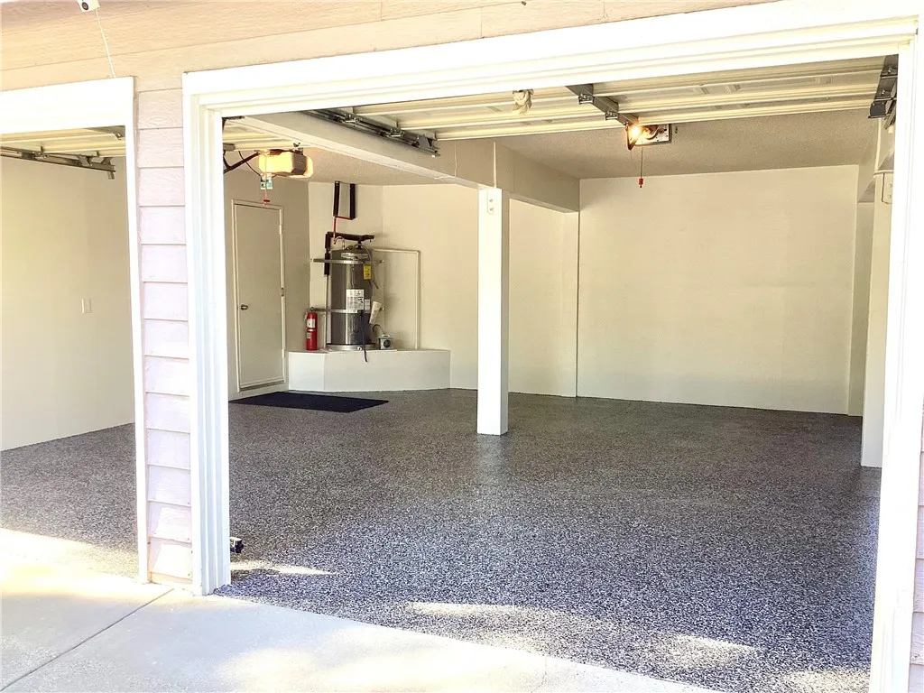 Garage with brand new sealed Epoxy flooring.
