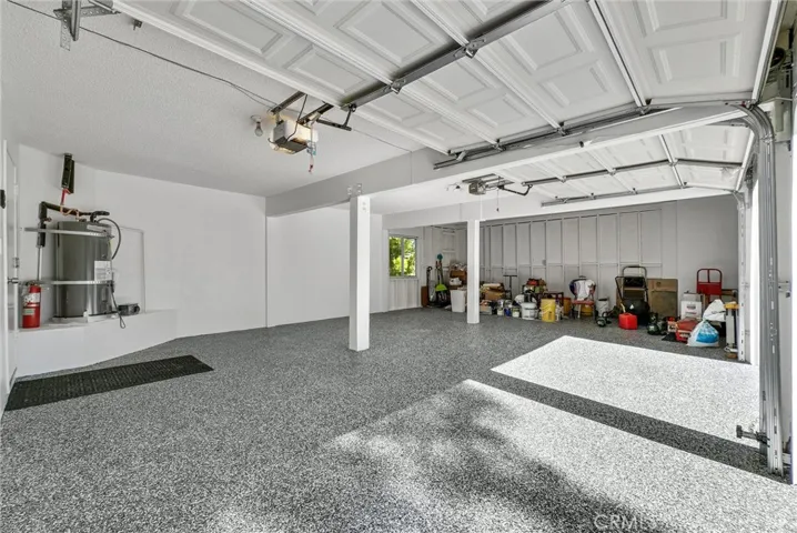 Garage with third space for car or large work bench/storage area.