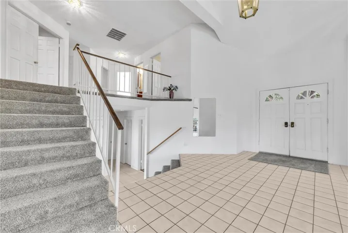 Short stairway to the upper bedrooms.  At entry to the home.