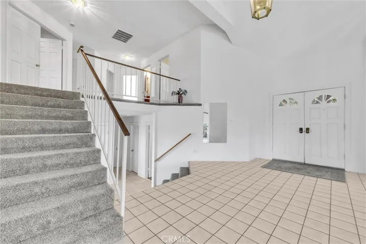 Short stairway to the upper bedrooms.  At entry to the home.