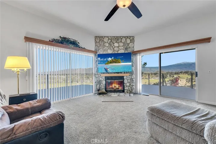 Family room with fireplace and sliders to the deck. Great views.