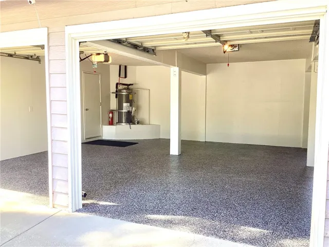 Garage with brand new sealed Epoxy flooring.