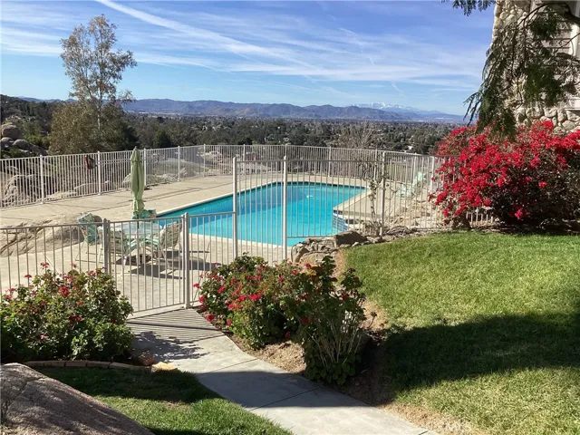 Landscaping with color leading to the front entry for the swimming pool.